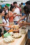 People Getting Food at Family Reunion