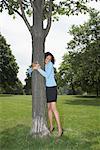 Woman Hugging Tree