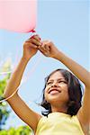 Girl Playing with Balloon