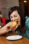 Woman Eating Hamburger