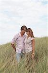 Couple Standing in Long Grass