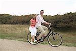 Couple Riding Bicycle Together