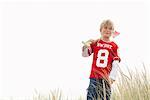 Portrait of Boy Carrying Shovel