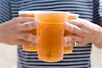 Man carrying cold pints of lager