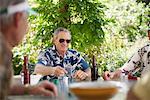 Men Playing Cards Outdoors