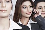 Close-up of three businesswomen looking away