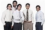 Portrait of five businessmen smiling