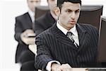 Close-up of a businessman working on a computer