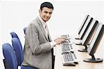 Portrait of a businessman sitting in front of a computer