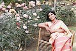 Portrait of a mature woman sitting in a garden