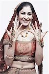 Portrait of a young woman with henna tattoo's on her hands