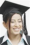 Close-up of a female graduate with her eyes closed