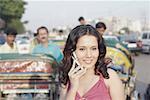 Close-up of a young woman talking on a mobile phone