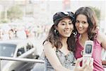 Close-up of two young women looking at a mobile phone