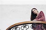 Low angle view of a teenage girl standing in a balcony