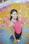 High angle view of a young woman standing in a swimming pool