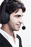 Close-up of a young man wearing a headset