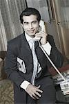 Portrait of a businessman talking on the telephone