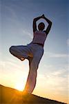 Young woman doing yoga exercises