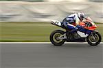 Racing motor bike on track