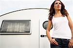 Woman Standing in Front of Trailer