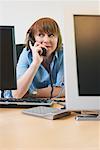 Woman Chatting on Telephone at Work