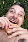 Man Eating Hamburger