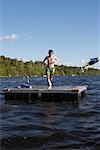 Boy Jumping Off Dock