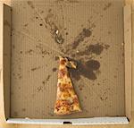 Stück Pizza in Box
