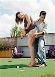 Couple Playing Golf