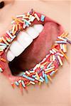 Woman with sugar sprinkles on her lips