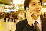 Close-up of a businessman talking on a mobile phone