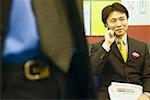 Businessman talking on a mobile phone sitting