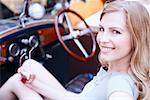 Side profile of a young woman in a car