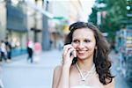 Close-up of a young woman talking on a mobile phone