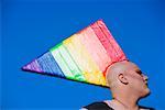 Close-up of a gay man wearing a colorful headdress