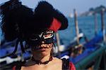 Portrait of a young woman wearing carnival mask, Venice, Veneto, Italy