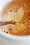 Close-up of a teaspoon in a cup of coffee