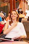 Young woman sitting in a restaurant and smiling