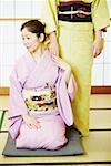 Two women wearing Kimonos