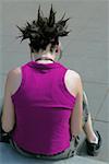 Rear view of a lesbian woman with spiked hair