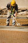 Construction worker using a shovel at a construction site