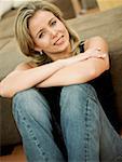 Portrait of a mid adult woman sitting with her arms crossed