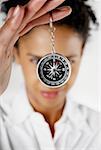 Close-up of a businesswoman holding a compass