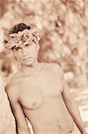 Close-up of a young man leaning against a tree, Hawaii, USA