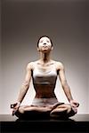 Young Asian woman in lotus position