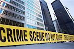 Crime Scene Tape in Front of Office Towers
