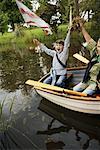 Boys in Rowboat Pretending to be Pirates