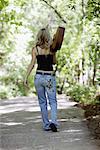 Girl Walking with Guitar