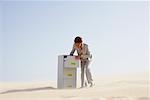 Business Woman and Filing Cabinet in Desert